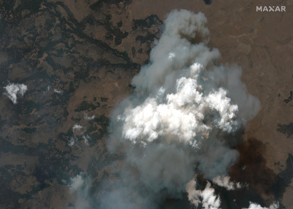 This satellite image provided by Satellite image ©2021 Maxar Technologies the Bootleg Fire in Oregon on Wednesday, July 21, 2021. The Oregon fire, which was sparked by lightning, has ravaged the sparsely populated southern part of the state and had been expanding by up to 4 miles (6 kilometers) a day, pushed by strong winds and critically dry weather that turned trees and undergrowth into a tinderbox. (Satellite image ©2021 Maxar Technologies via AP)