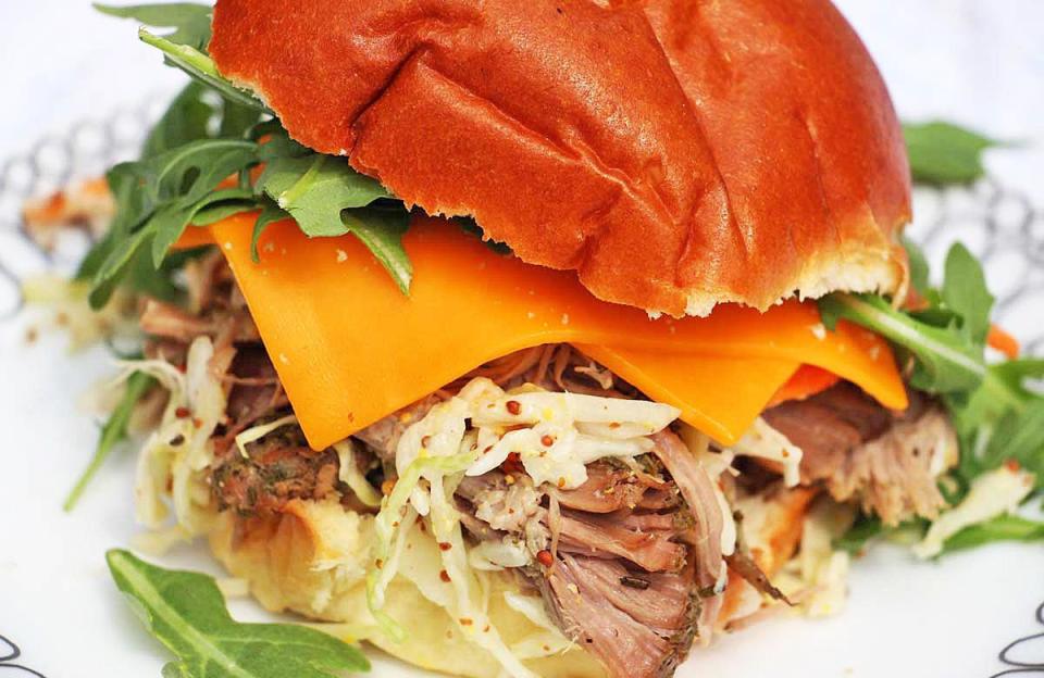 <p>Like any good pulled-pork recipe, this one requires that you let the meat slow cook for eight hours. Make it the night before and by morning, <a href="https://www.thedailymeal.com/best-recipes/101-best-slow-cooker-recipes-slideshow?referrer=yahoo&category=beauty_food&include_utm=1&utm_medium=referral&utm_source=yahoo&utm_campaign=feed" rel="nofollow noopener" target="_blank" data-ylk="slk:you’ll have a week’s worth of dinner in the Crock-Pot;elm:context_link;itc:0;sec:content-canvas" class="link ">you’ll have a week’s worth of dinner in the Crock-Pot</a>.</p> <p><a href="https://www.thedailymeal.com/pulled-pork-sandwich?referrer=yahoo&category=beauty_food&include_utm=1&utm_medium=referral&utm_source=yahoo&utm_campaign=feed" rel="nofollow noopener" target="_blank" data-ylk="slk:For the Pulled Pork Sandwich recipe, click here.;elm:context_link;itc:0;sec:content-canvas" class="link ">For the Pulled Pork Sandwich recipe, click here.</a></p>