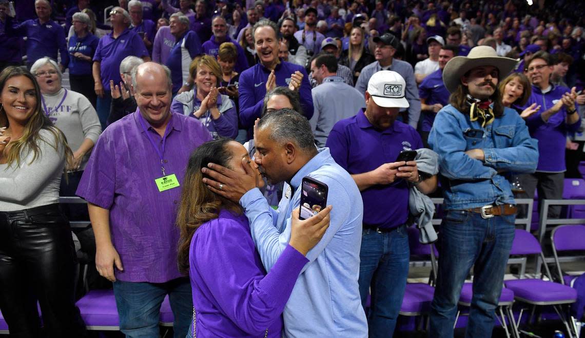 Kansas State coach Jerome Tang gets a victory kiss from his wife after the Wildcats beat KU 83-82 Tuesday night at Bramlage Coliseum in Manhattan.