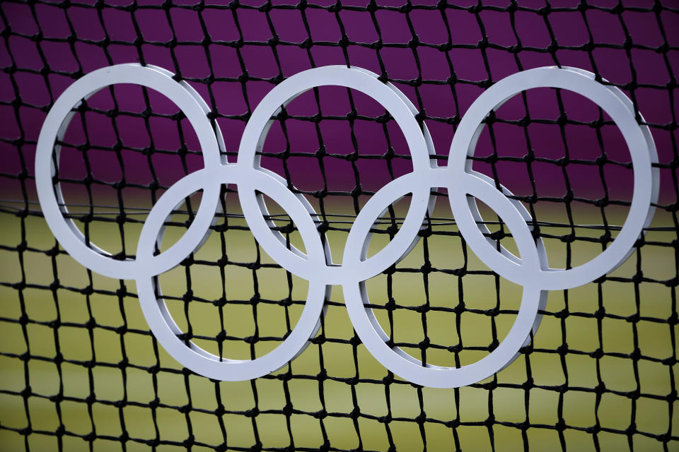 A detail view of the Olympic rings on a tennis net during Day 3 of the London 2012 Olympic Games at the All England Lawn Tennis and Croquet Club in Wimbledon on July 30, 2012 in London, England. (Photo by Jamie Squire/Getty Images)