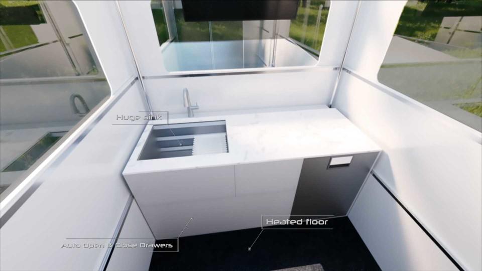 Clean minimalist kitchen area inside the CyberLandr Cybertruck Camper add-on. 