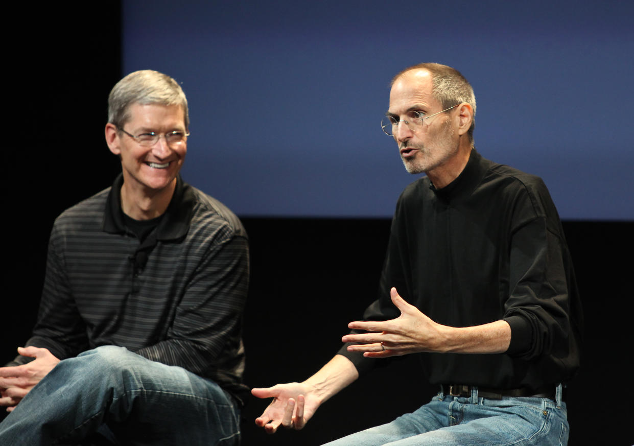 Steve Jobs (R), Apple Inc. CEO, and Tim Cook, Apple Inc. Coo, speak at a press conference at Apple headquarters in Cupertino, California.  (Photo by Kimberly White/Corbis via Getty Images)