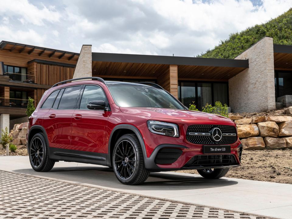 A red SUV parked.