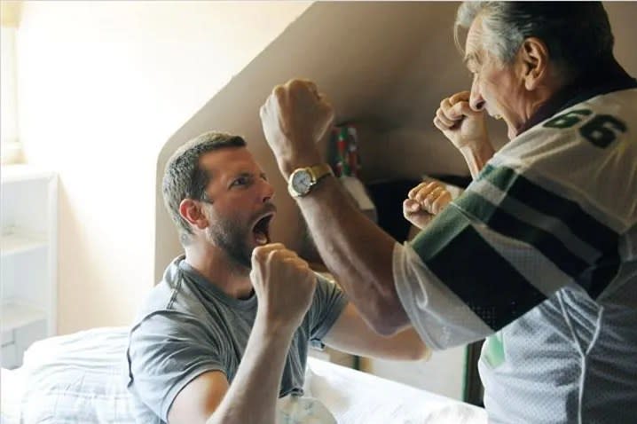 Bradley Cooper and Robert De Niro celebrate in Silver Linings Playbook.