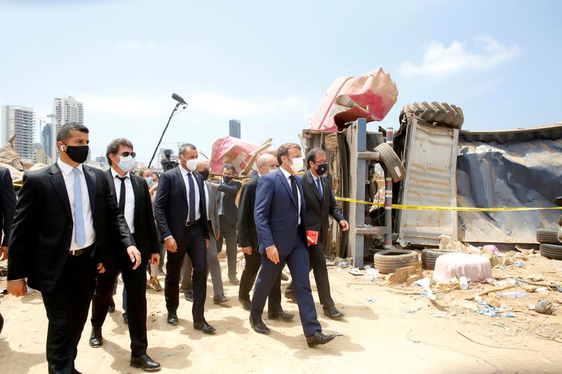 FILE PHOTO: French President Emmanuel Macron visits the devastated site of the explosion at the port of Beirut