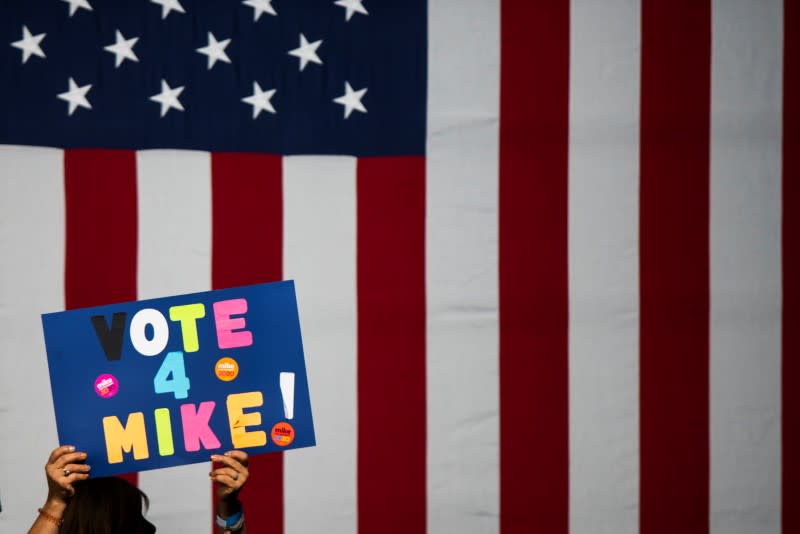 A woman holds a placard as people attend the campaign event "Women for Mike" by Democratic U.S. presidential candidate Bloomberg in the Manhattan borough of New York City, New York