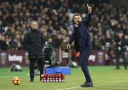 <p>West Ham United’s Slaven Bilic, right, gestures to the referee as he appeals for his team to get a throw in during their English Premier League soccer match between West Ham United and Manchester United at the London stadium, in London Monday, Jan. 2, 2017. (AP Photo/Alastair Grant) </p>