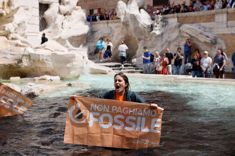 Trevi Fountain water turns black in Rome climate protest