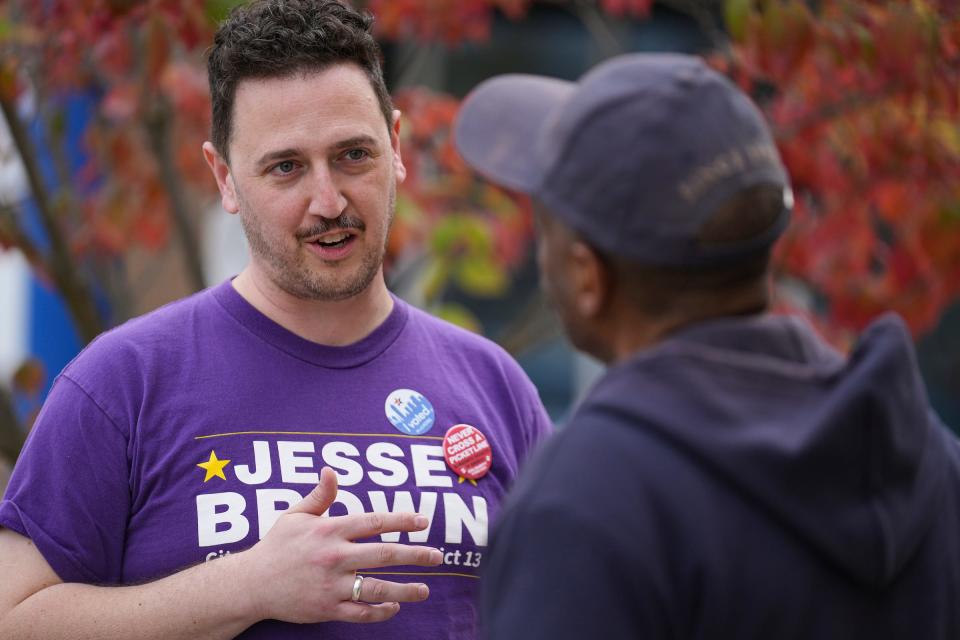 Jesse Brown, the Democratic candidate for Indianapolis City Council District 13, talks to passersby on Election Day, Tuesday, Nov. 7, 2023, outside the John Boner Neighborhood Center in Indianapolis.