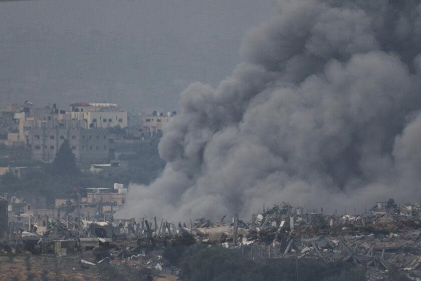 Smoke rises following an Israeli bombardment in the Gaza Strip, as seen from southern Israel, Thursday, Dec. 7, 2023. (AP Photo/Leo Correa)