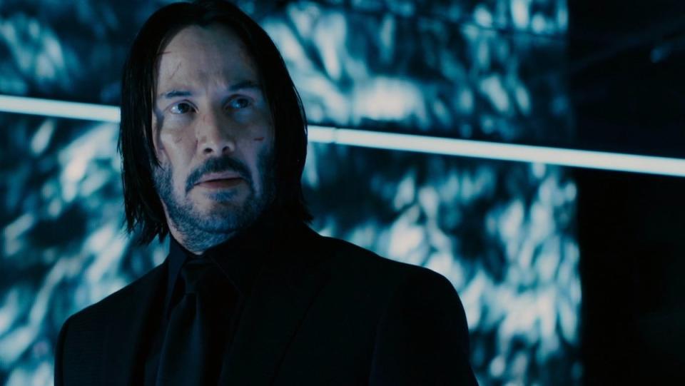 Keanu Reeves in a black suit and shirt in Chapter 3- Parabellum