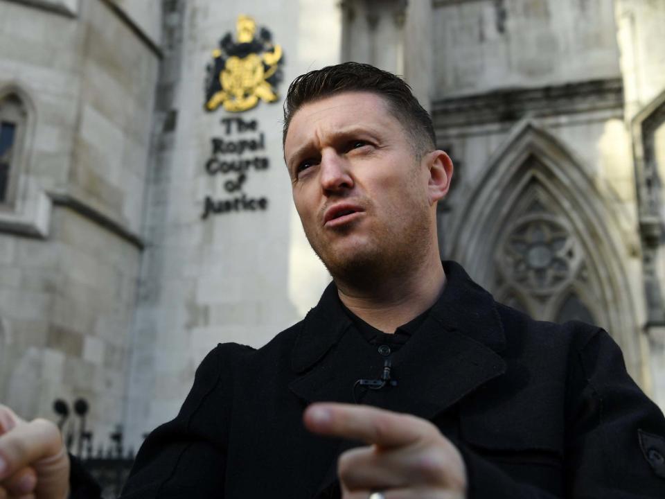 Tommy Robinson tells supporters to vote for Boris Johnson's Conservative Party outside the High Court in London: EPA/Andy Rain