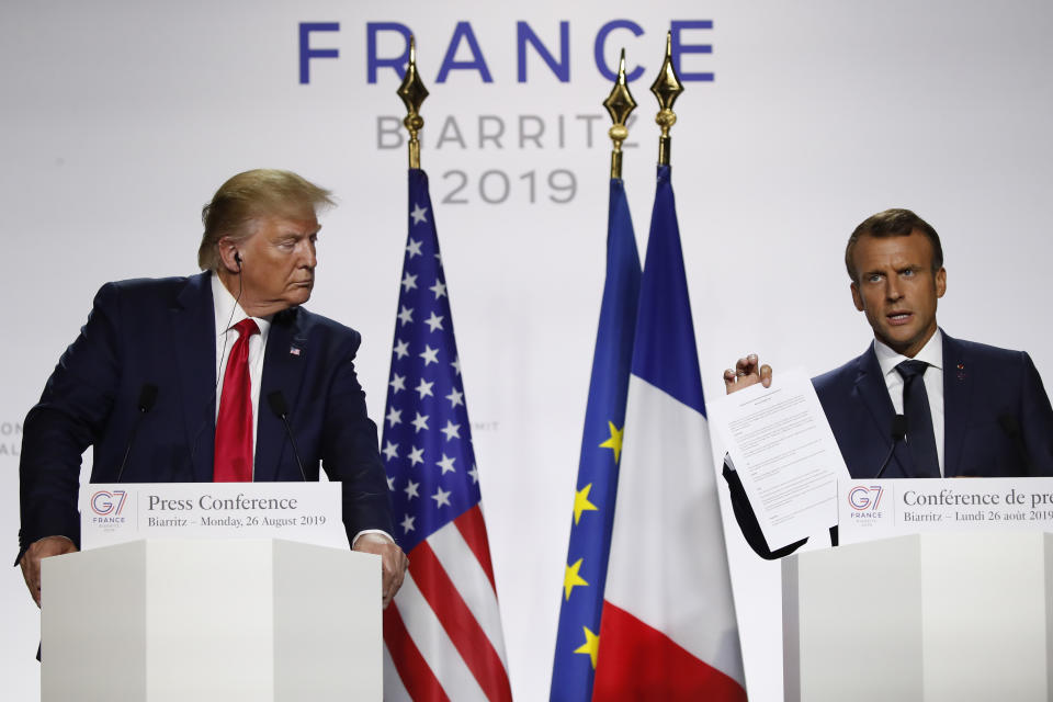 French President Emmanuel Macron, right, and U.S President Donald Trump attend the final press conference during the G7 summit Monday, Aug. 26, 2019 in Biarritz, southwestern France. (AP Photo/Francois Mori)