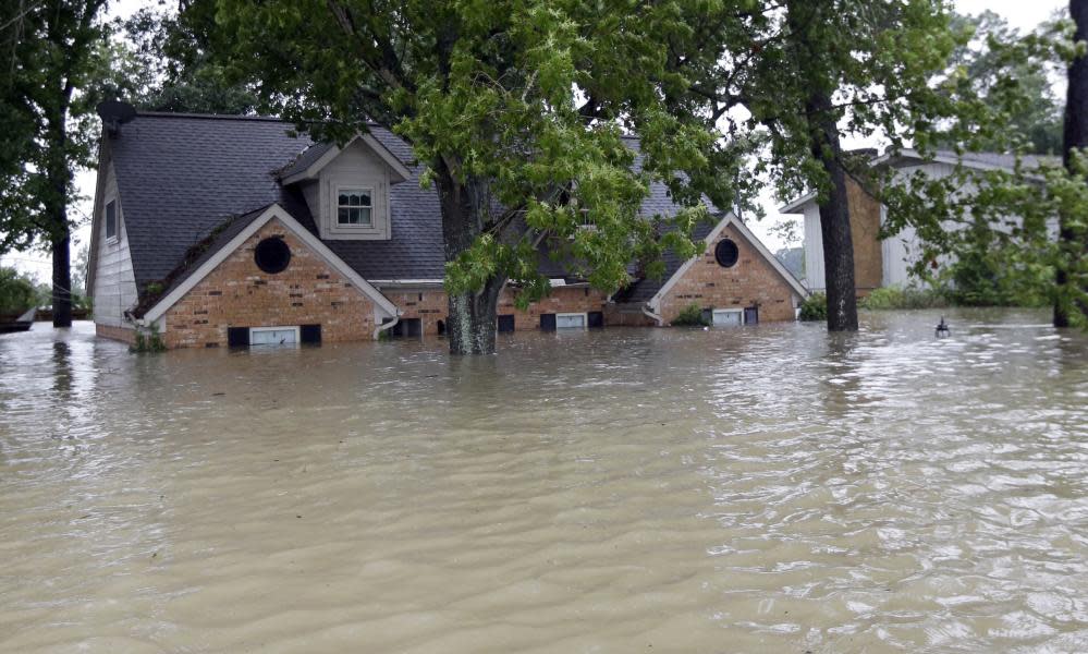 A home is surrounded by floodwaters from Tropical Storm Harvey in Spring, Texas on 28 August 2017.