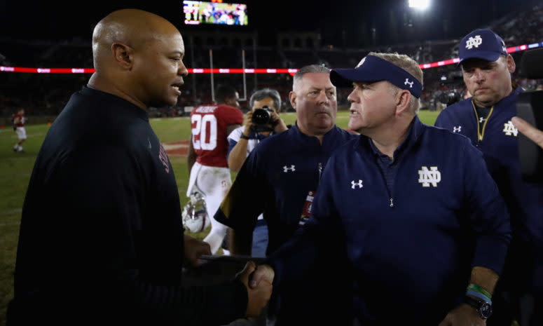 Notre Dame coach Brian Kelly shaking hands with Stanford coach David Shaw after a game.