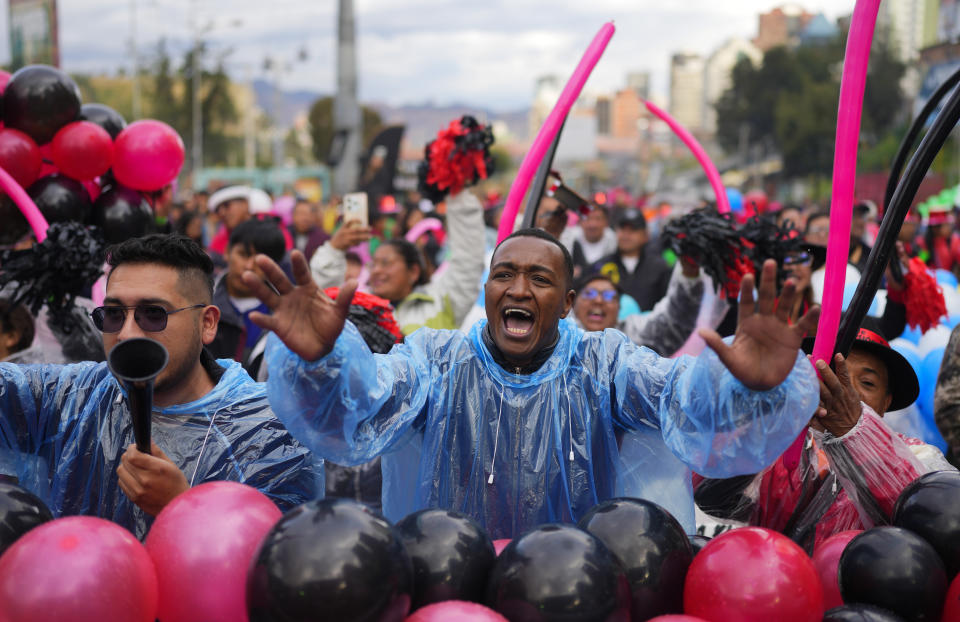 People cheer for their favorite contestant during the Queen of Great Power contest, in La Paz, Bolivia, May 1, 2024. The contest takes place ahead of the Festival of the Lord Jesus of Great Power, a street party that celebrates a rendering of Jesus Christ with native features and outstretched arms. (AP Photo/Juan Karita)