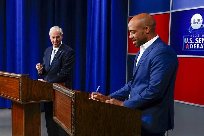 U.S. Sen. Ron Johnson and his Democratic challenger Mandela Barnes take notes before a televised debate, Oct. 7, 2022, in Milwaukee.