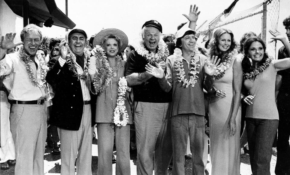 FILE - This Oct. 2, 1978 file photo shows the cast of "Gilligan's Island," from left, Russell Johnson, as the professor; Jim Backus as Thurston Howell III; Natalie Schafer, as Mrs. Howell III; Alan Hale Jr., as the skipper; Bob Denver, as Gilligan; Judith Baldwin replacing original cast member Tina Louise, as Ginger, and Dawn Wells, as Mary Ann, posing during filming of a two-hour reunion show, "The Return from Gilligan's Island," in Los Angeles. Johnson died Thursday, Jan. 16, 2014, at his home in Washington State of natural causes. He was 89. (AP Photo/Wally Fong, File)