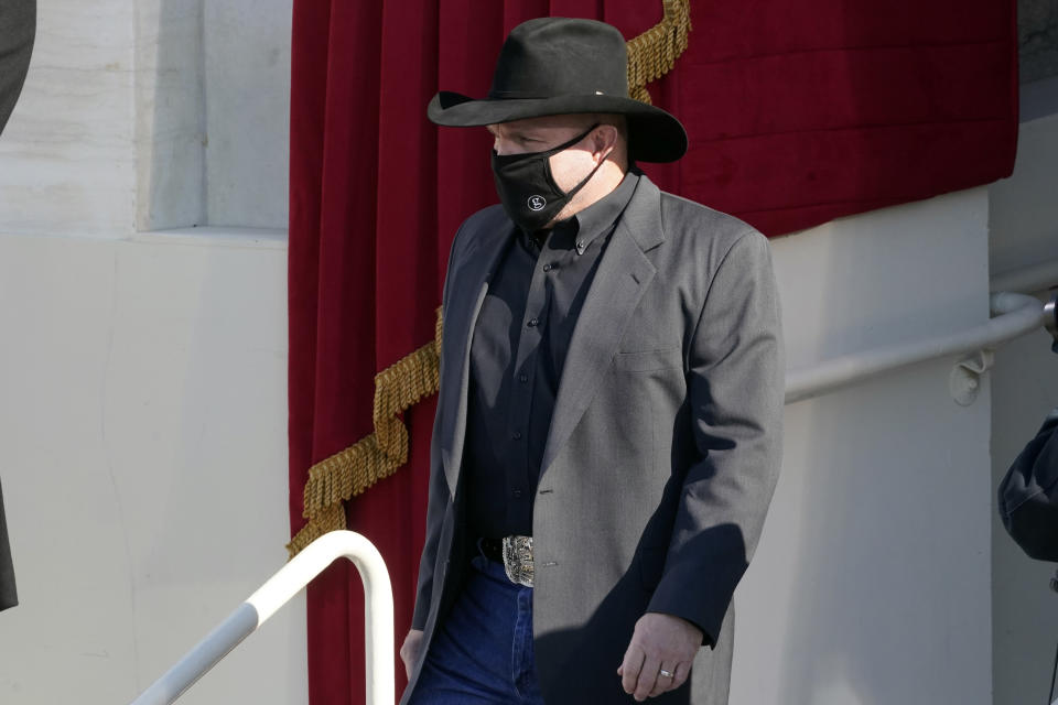 Garth Brooks arrives to sing 'Amazing Grace' as President Joe Biden listens during the 59th Presidential Inauguration at the U.S. Capitol in Washington, Wednesday, Jan. 20, 2021. (AP Photo/Andrew Harnik)