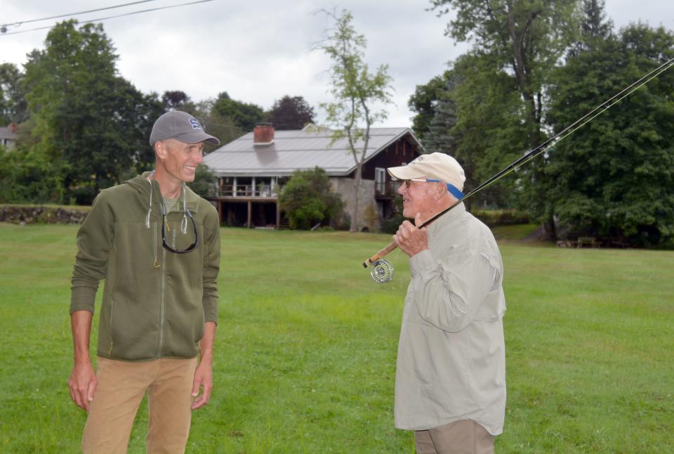 Geoge Daniel, left, and Joe Humphreys share a story about fly fishing.