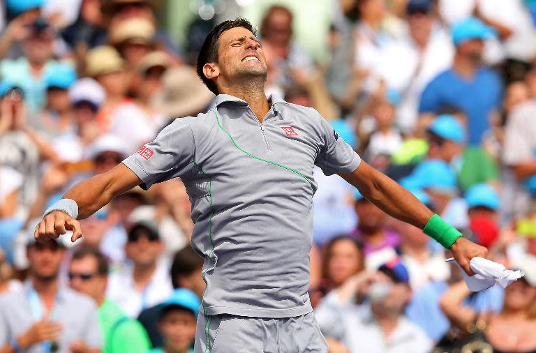 Novak Djokovic of Serbia reacts after defeating Rafael Nadal of Spain on March 30, 2014 in Key Biscayne, Florida