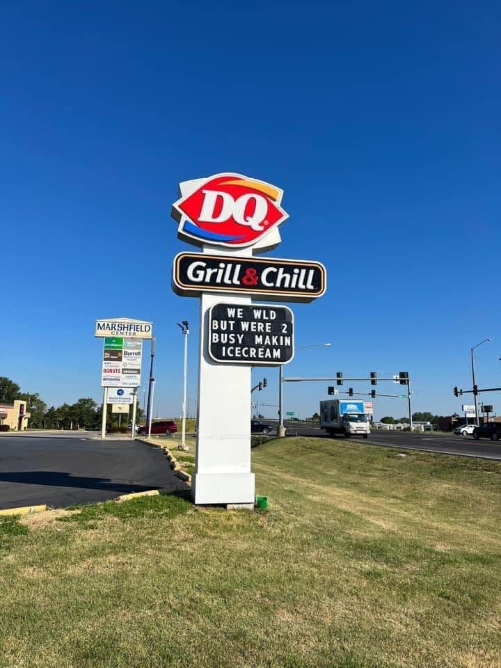 a Dairy Queen sign that says "we would but we're too busy making ice cream"