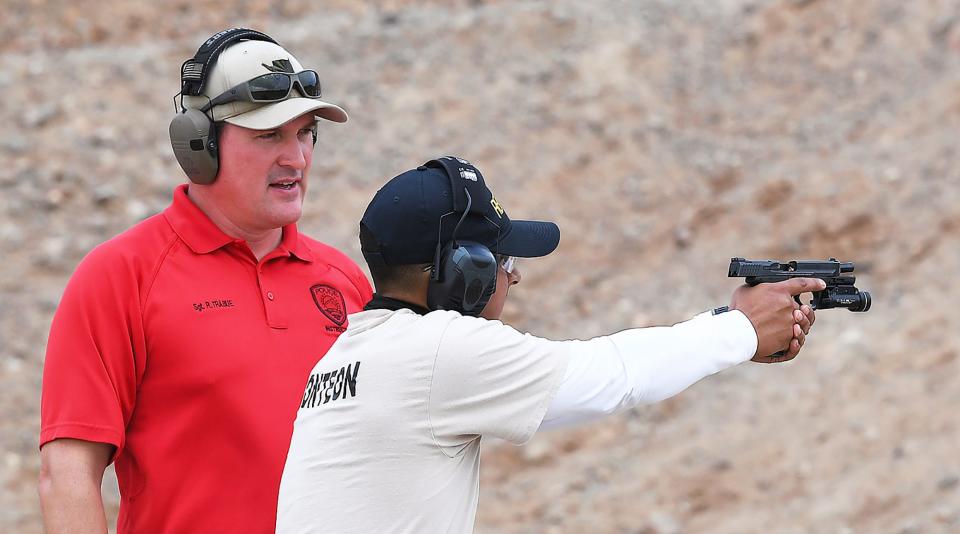 Yuma Police Department Sgt. Robert Trabue, left, works with Arizona Western College Law Enforcement Training Academy recruit Eduardo Monteon during a session at the Police Combat facility inside N.R. Adair Park Shooting Range, on June 22, 2021, in Yuma, Arizona. The recruits are working through 20 weeks of intensive training before becoming certified as law enforcement officers in Arizona.