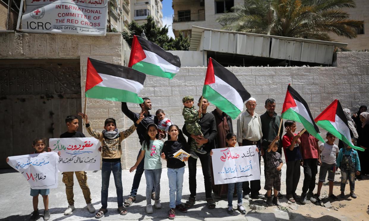 <span>People protest in front of the ICRC building in Gaza City in support of Palestinians held in Israeli jails, 6 May 2024.</span><span>Photograph: Dawoud Abo Alkas/Anadolu/Getty Images</span>