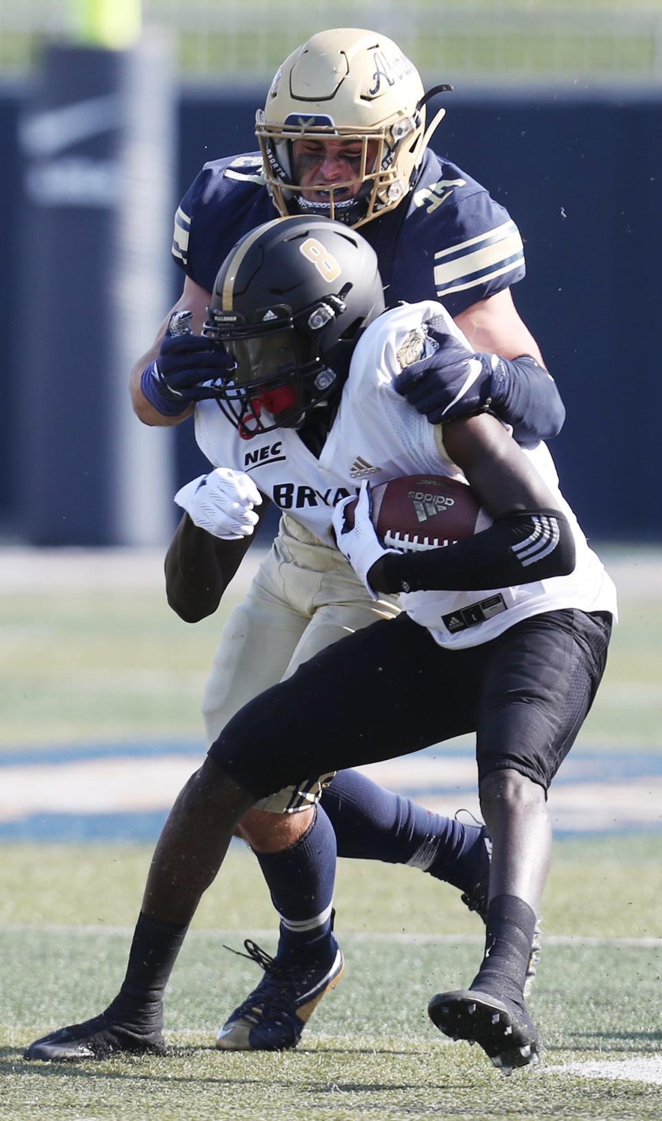 Akron Bubba Arslanian tackles Bryant Psaveon Reaves in the first half of their game at University of Akron InfoCision Stadium Summa Field on Saturday, Sept. 18, 2021, in Akron.