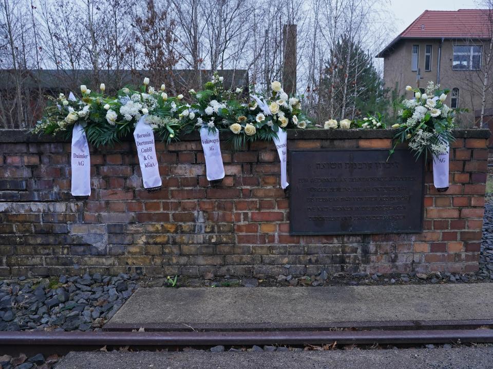 Wreaths left by German corporations, including Volkswagen, Deutsche Bahn, Deutsche Bank and Daimler, as well as the Borussia Dortmund football team, lie at the Track 17 memorial that commemorates Berlin Jews transported to concentration camps during the Holocaust.