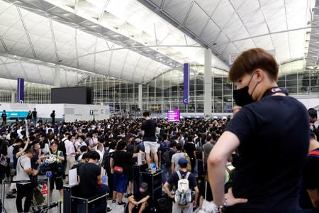 Anti-Extradition bill protesters attend a mass demonstration at the Hong Kong international airport, in Hong Kong