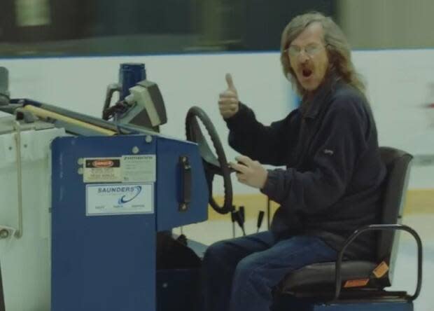 Tony Fowlow does what he loves best — driving the Zamboni and clearing the ice at the Glacier in Mount Pearl. He was sidelined by a stroke in December. (City of Mount Pearl/YouTube - image credit)