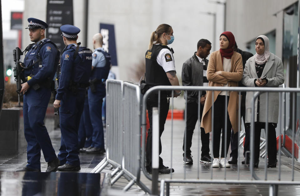 Family and survivors from the March 2019 Christchurch mosque shootings arrive outside the Christchurch High Court for the sentencing of twenty-nine-year-old Australian Brenton Harrison Tarrant, in Christchurch, New Zealand, Monday, Aug. 24, 2020. Tarrant has pleaded guilty to 51 counts of murder, 40 counts of attempted murder and one count of terrorism in the worst atrocity in the nation's modern history. (AP Photo/Mark Baker)