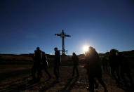 Visitors walk past the Cross for the Fallen in the old village of Belchite, in northern Spain, November 13, 2016. REUTERS/Andrea Comas