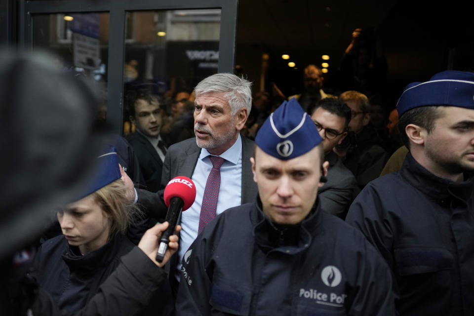 Member of the Flemish separatist party Vlaams Belang, Filip Dewinter, center, speaks with the media outside the National Conservatism conference in Brussels, Tuesday, April 16, 2024. (AP Photo/Virginia Mayo)