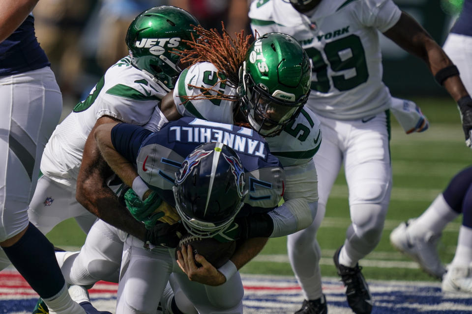 Tennessee Titans quarterback Ryan Tannehill (17) is sacked by New York Jets middle linebacker C.J. Mosley (57) during the first half of an NFL football game, Sunday, Oct. 3, 2021, in East Rutherford, N.J. (AP Photo/Seth Wenig)