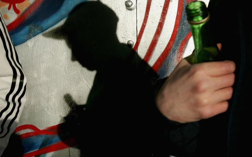 A youth holds a bottle of Buckfast - Credit: Christopher Furlong/Getty Images 