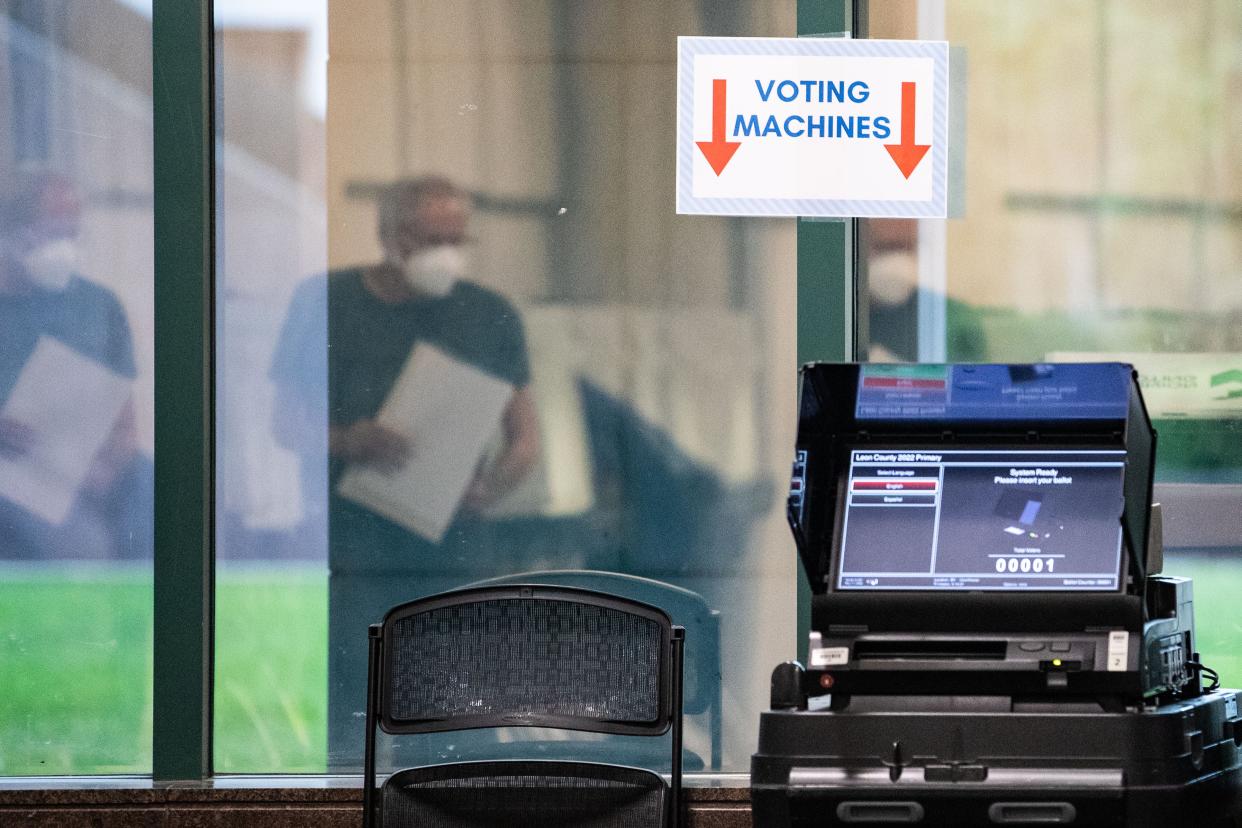 Voting machines stationed near the exit of voting sites count ballots as voters submit them Saturday, Aug. 13, 2022.