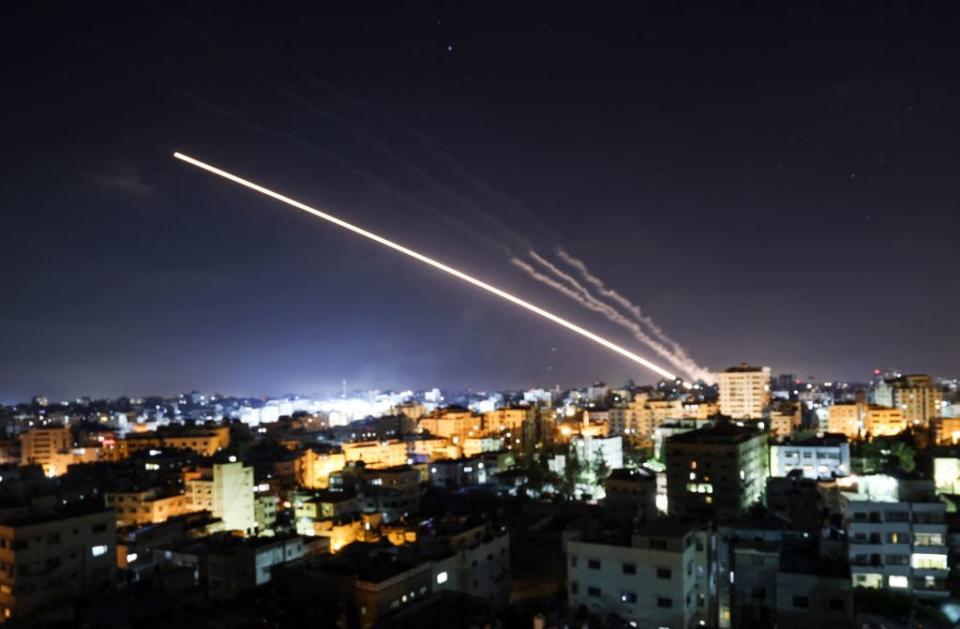 Rockets are launched from Gaza City, controlled by the Palestinian Hamas movement, towards Israel early on May 15, 2021. 