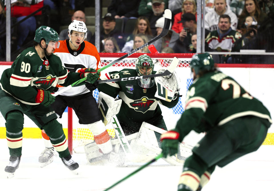 Minnesota Wild goaltender Marc-Andre Fleury, third from left, watches play during the second period of an NHL hockey game against the Philadelphia Flyers, Friday, Jan. 12, 2024, in St. Paul, Minn. (AP Photo/Adam Bettcher)