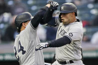 New York Yankees' Rougned Odor, right, and Gary Sanchez celebrate after Odor hit a two-run home run in the second inning of a baseball game against the Cleveland Indians, Friday, April 23, 2021, in Cleveland. Sanchez also scored on the play. (AP Photo/Tony Dejak)