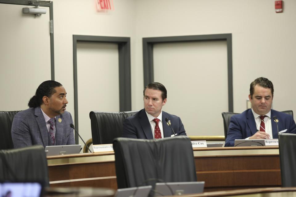 South Carolina Reps. Justin Bamberg, D-Bamberg, left, Bobby Cox, R-Greer, center, and Micah Caskey, R-Springdale, right, debate a version of a bill that would allow open carry of guns on Tuesday, March 5, 2024, in Columbia, S.C. (AP Photo/Jeffrey Collins)