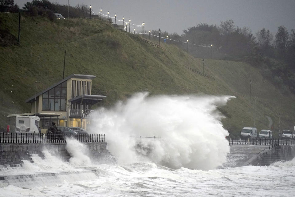 Waves crash over the promenade in Scarborough, northeastern England, Friday, Oct. 20, 2023. The gale-force winds are expected to hit hardest the eastern part of Denmark's Jutland peninsula and the Danish islands in the Baltic Sea. But the British Isles, southern Sweden, northern Germany and parts of Norway also on the path of the storm, named Babet by U.K.’s weather forecaster, the Met Office. (Danny Lawson/PA via AP)