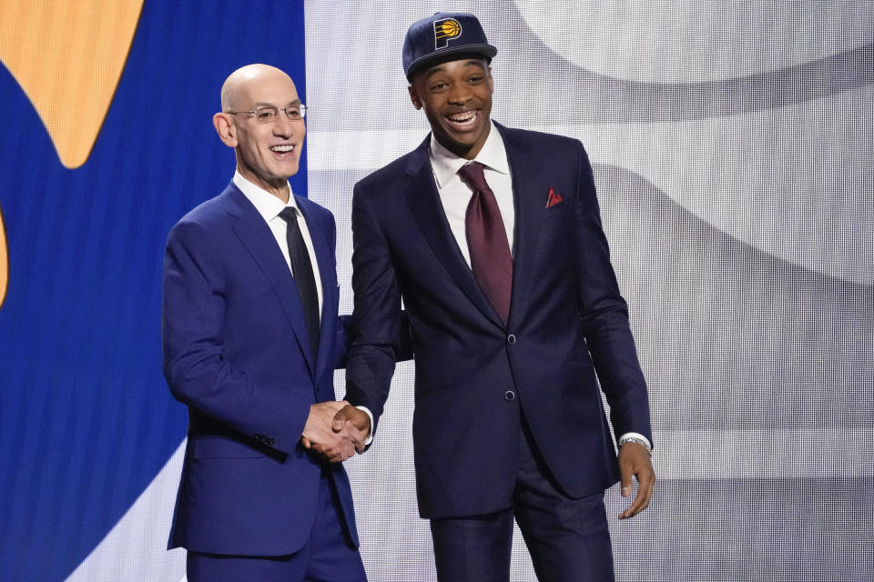 Bilal Coulibaly poses for a photo with NBA Commissioner Adam Silver after being selected seventh overall by the Indiana Pacers during the NBA basketball draft, Thursday, June 22, 2023, in New York. (AP Photo/John Minchillo)