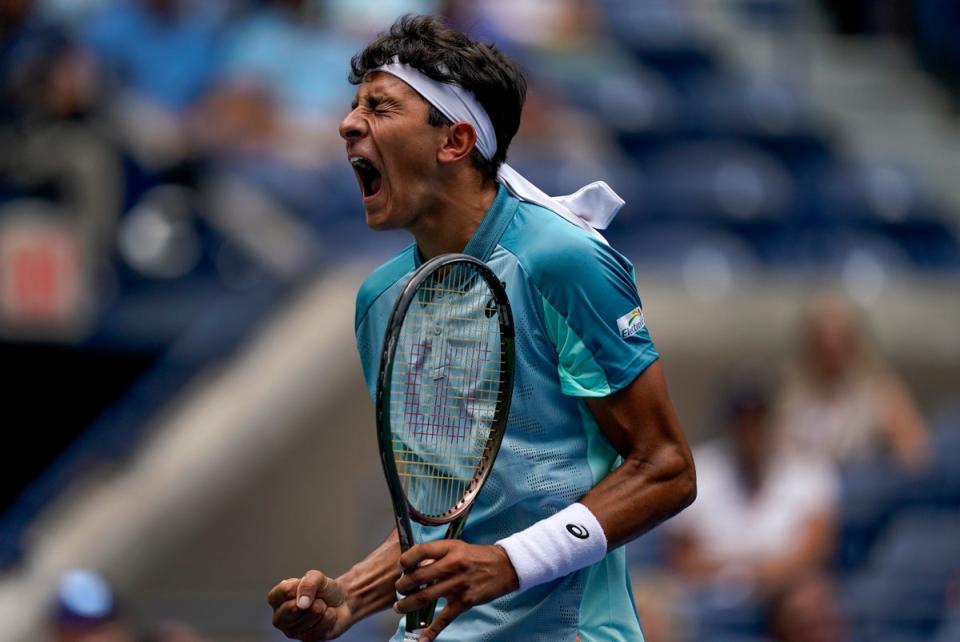 Emilio Nava celebrates winning the first set (Julia Nikhinson/AP) (AP)