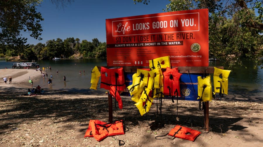 Several Type I and Type II life jackets are made available to swimmers at Discovery Park in Sacramento, California. (Getty Images)