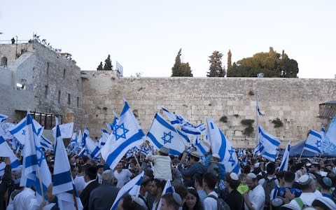 Thousands of Israelis marched to the Western Wall to mark "Jerusalem Day" - Credit: Getty Images