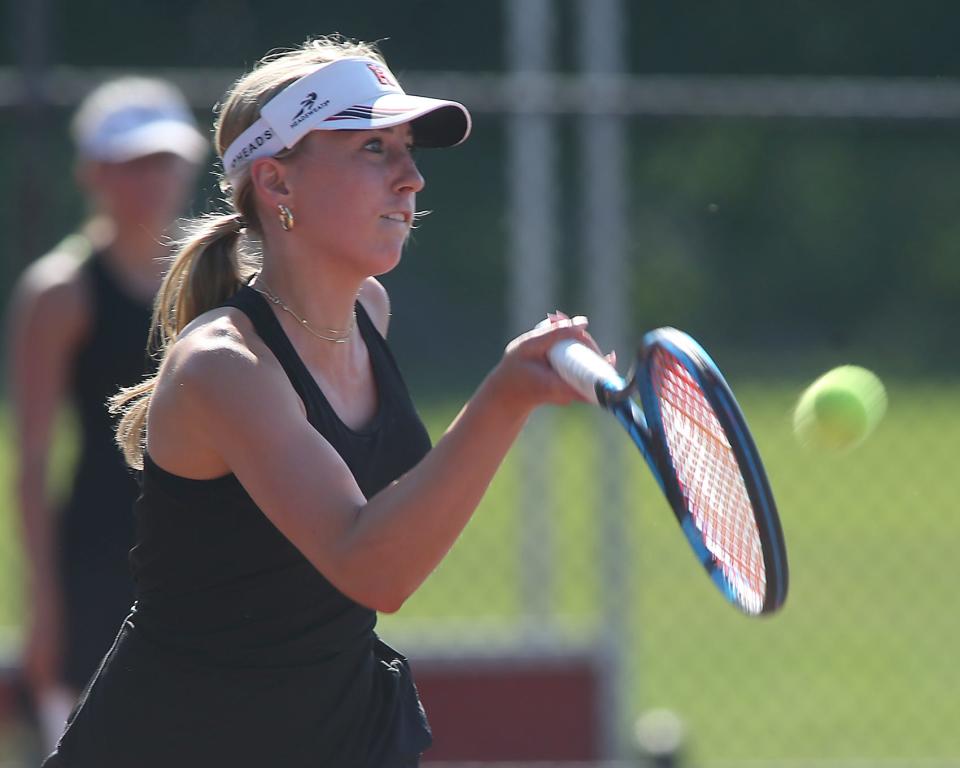 Hingham No. 2 Katelyn Erickson reaches out for a forehand return during her Round of 32 match against Shrewsbury in the Division 1 state tournament at Hingham High on Wednesday, May 31, 2023.