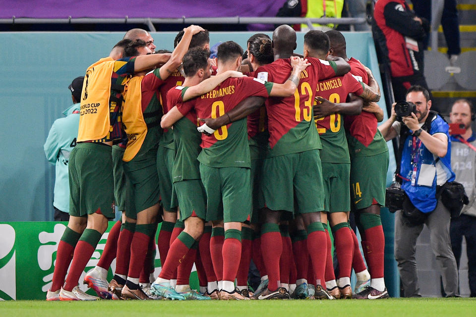 DOHA, QATAR - NOVEMBER 24: Cristiano Ronaldo of Portugal celebrates after scoring his sides first goal with his teammates during the Group H - FIFA World Cup Qatar 2022 match between Portugal and Ghana at the Stadium 974 on November 24, 2022 in Doha, Qatar (Photo by Pablo Morano/BSR Agency/Getty Images)