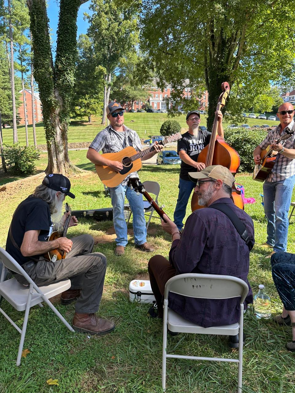 Members of Southern Heritage are joined by David Robinson's son, Alex, standing at left, and his son-in-law, Sammy Adams, standing at right, prior to taking the stage Sept. 23 at the Lunsford Festival.